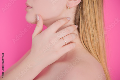Woman's hands with jewelry rings. Close-up beauty and fashion portrait. Girl with pastel manicure. Jewelry and luxury concept. Beautiful woman with stylish accessories 