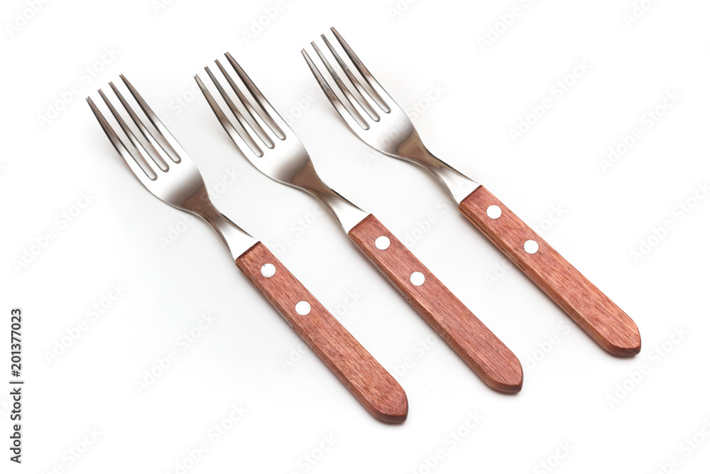 Set of three forks with wooden handles on white background Set of three forks with wooden handles on white background