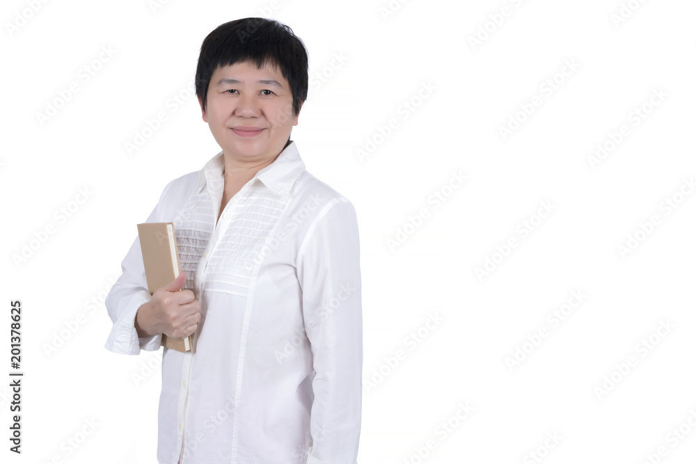 Asian Middle-aged woman in white shirt holding book in her hand isolated on white background Asian Middle-aged woman in white shirt holding book in her hand isolated on white background