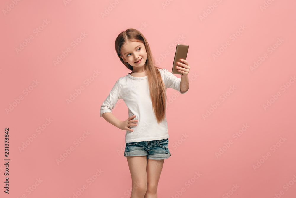 The happy teen girl making selfie photo by mobile phone The happy teen girl making selfie photo by mobile phone