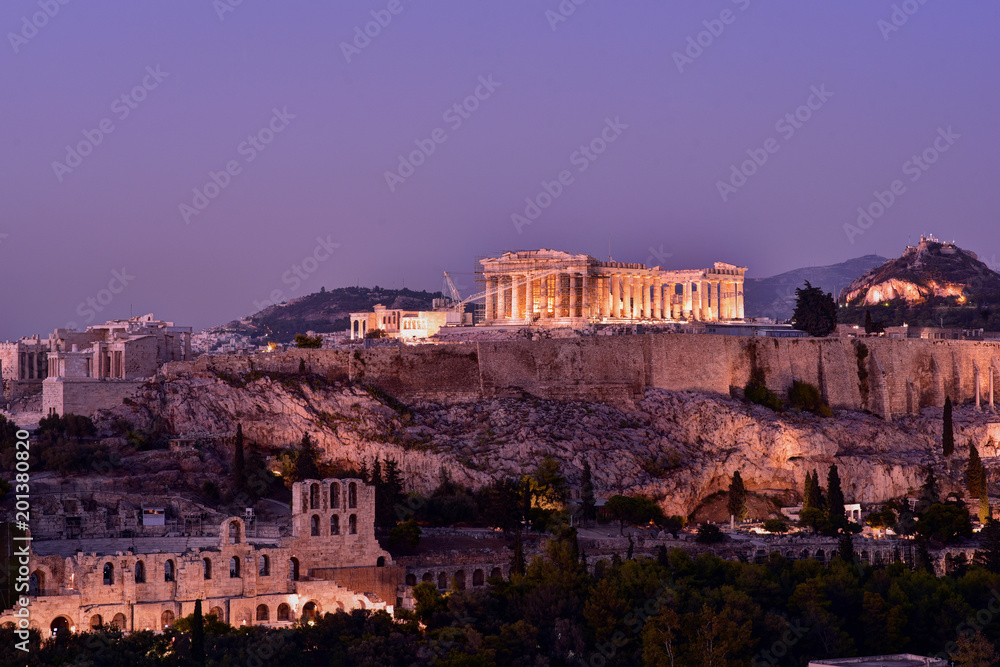 Panoramic Skyline of the capital city of Athens and the famous Acropolis Hill in Greece at dusk