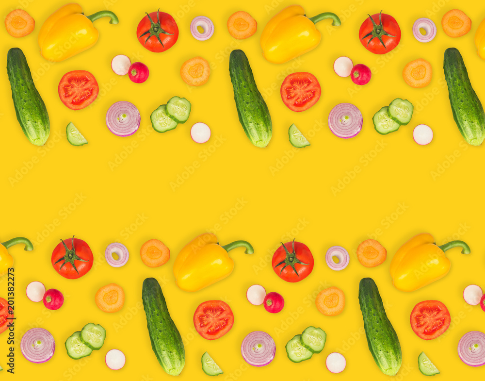 Vegetable mix on yellow isolated background. Fresh yellow pepper, chopped tomatoes, onion, round cucumber slice, carrot, radish. The concept of a healthy lifestyle. Vegetarian food. Vegetable mix on yellow isolated background. Fresh yellow pepper, chopped tomatoes, onion, round cucumber slice, carrot, radish. The concept of a healthy lifestyle. Vegetarian food.
