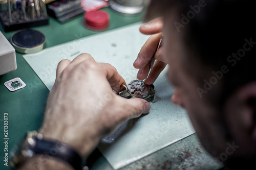 Close Up shot of a Watchmaker at Work