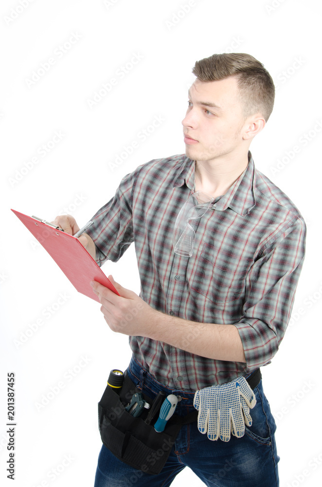 Young engineer. An attractive guy. White background. Young engineer. An attractive guy. White background.