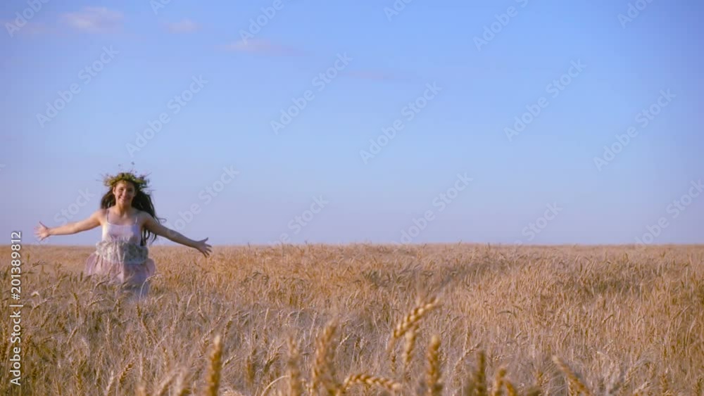 girl running on golden wheat field, slow motion girl running on golden wheat field, slow motion