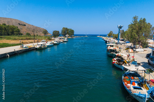 Fishing boats at Kournas lake in Georgioupoli village in Chania, Crete, Greece. It is the only freshwater lake on Crete which is fed by streams from the nearby mountains and hills