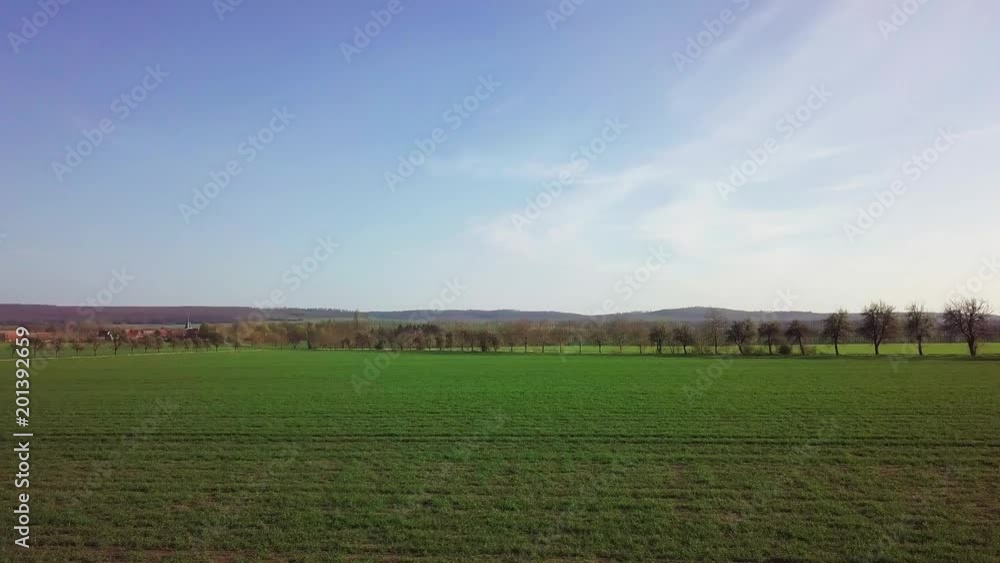 Trees and fields near Anderbeck and Badersleben in Saxony-Anhalt ( Germany ) from above in spring at sunset Trees and fields near Anderbeck and Badersleben in Saxony-Anhalt ( Germany ) from above in spring at sunset