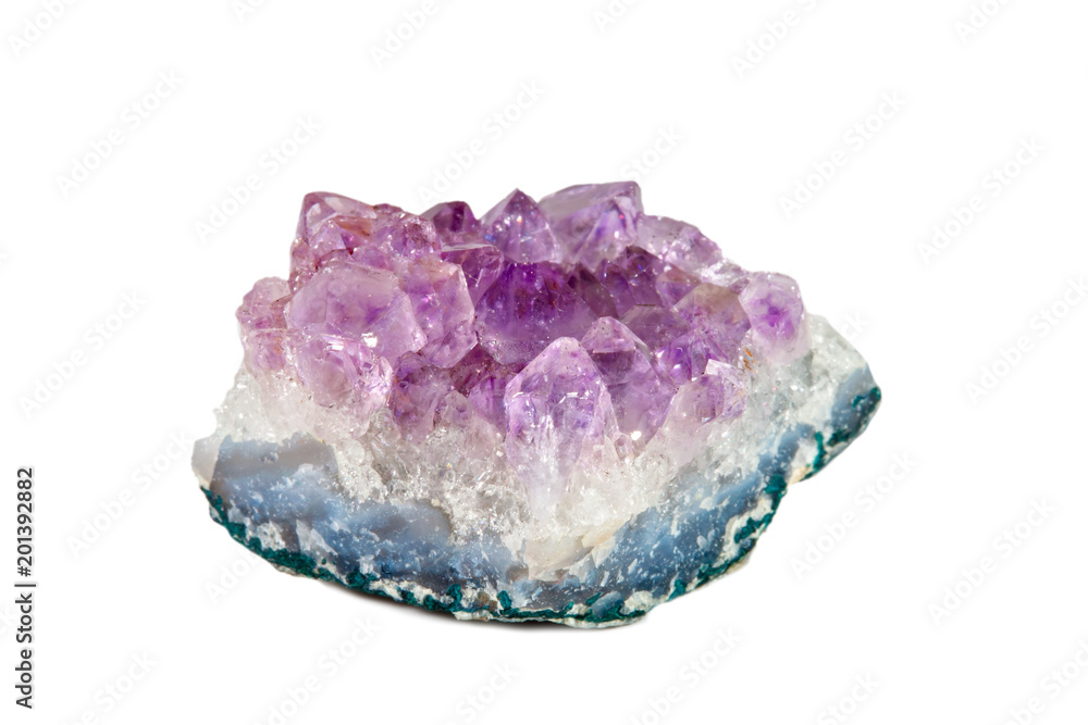 Macro shooting of natural gemstone. Mineral amethyst. Isolated object on a white background.