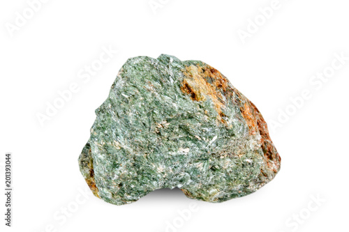 Macro shooting of natural gemstone. The raw mineral is diopside, Brazil. Isolated object on a white background. photo