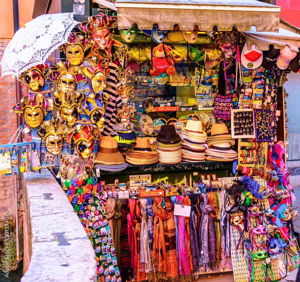Local street vendors waiting for customer at the corner of venice selling Masks in Italy