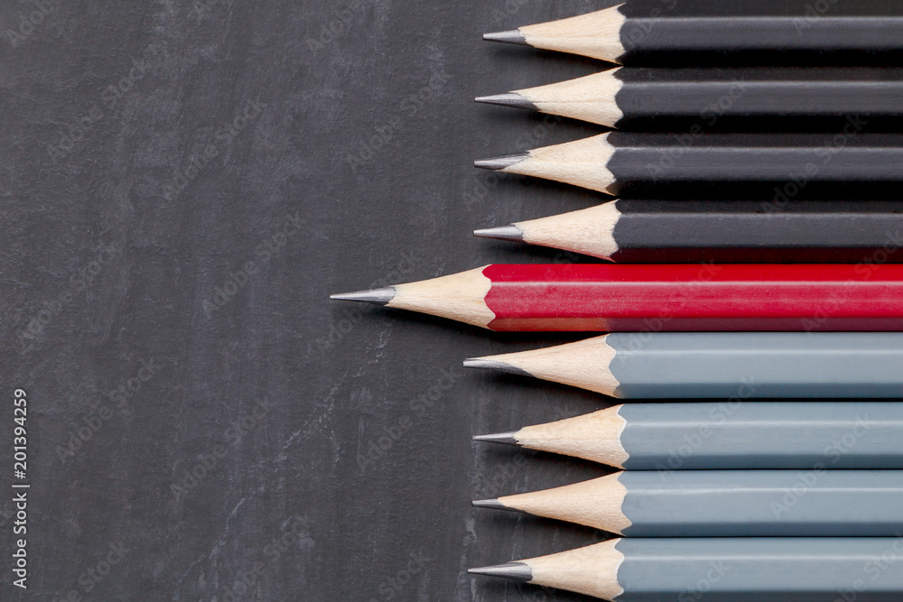 Obraz premium Pencils glyph on a black surface, top view