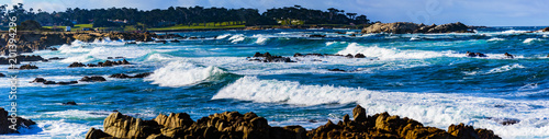 Surf Rocks -Pebble Beach, California, February 18, 2018:  Wave action on the rocks at Pebble Beach highlighting Bird Rock, Seal Rock, Cypress Point Golf Course, Fan Shell Beach located on 17 Mile Dr.