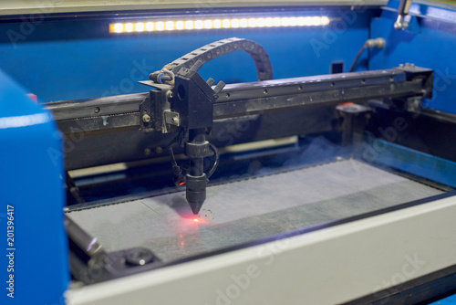 Slika na platnu Laser cutting machine engraving picture on plastic film