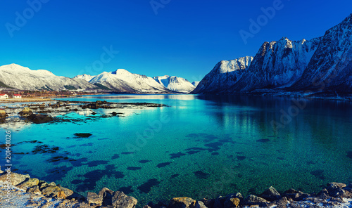 Panoramic view of beautiful winter lake with snowy mountains at Lofoten Islands in Northern Norway