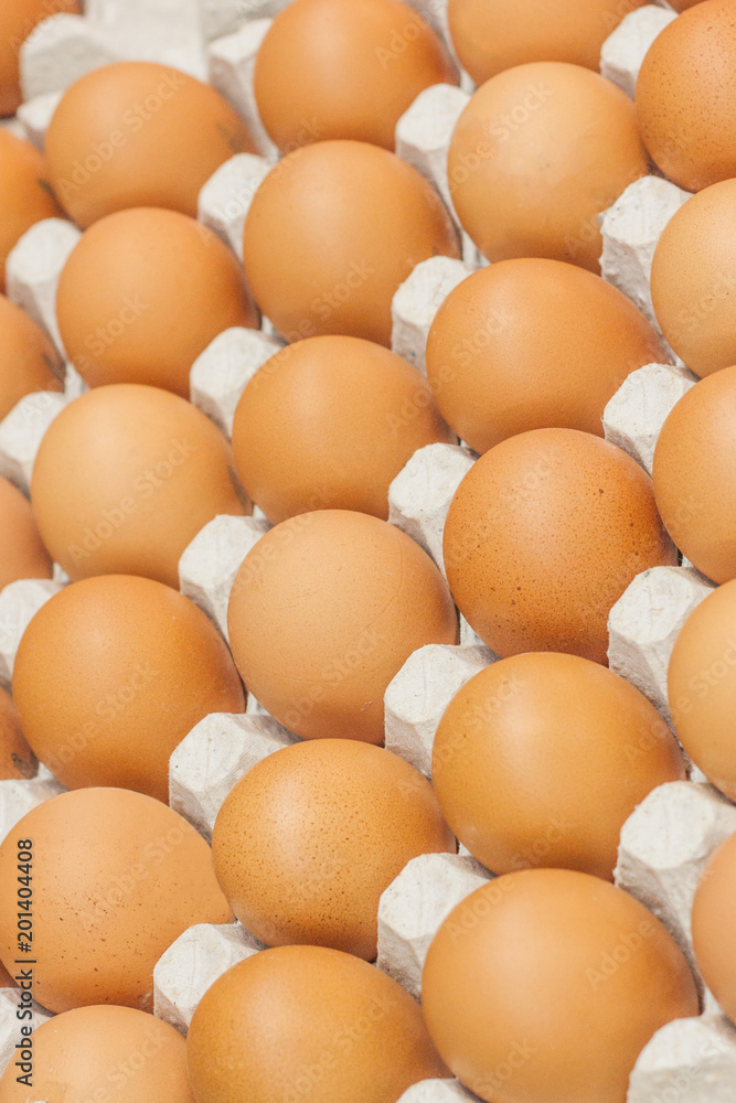 Many brown eggs in boxes in store close up Many brown eggs in boxes in store close up