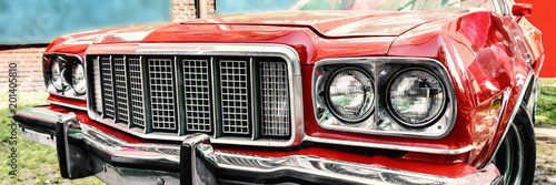 Fotografie red shiny muscle car front on the sunny day