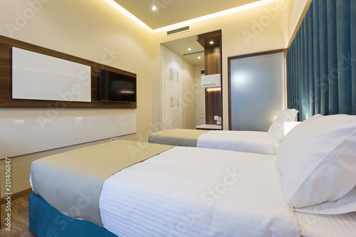 Interior of a double bed hotel bedroom © rilueda