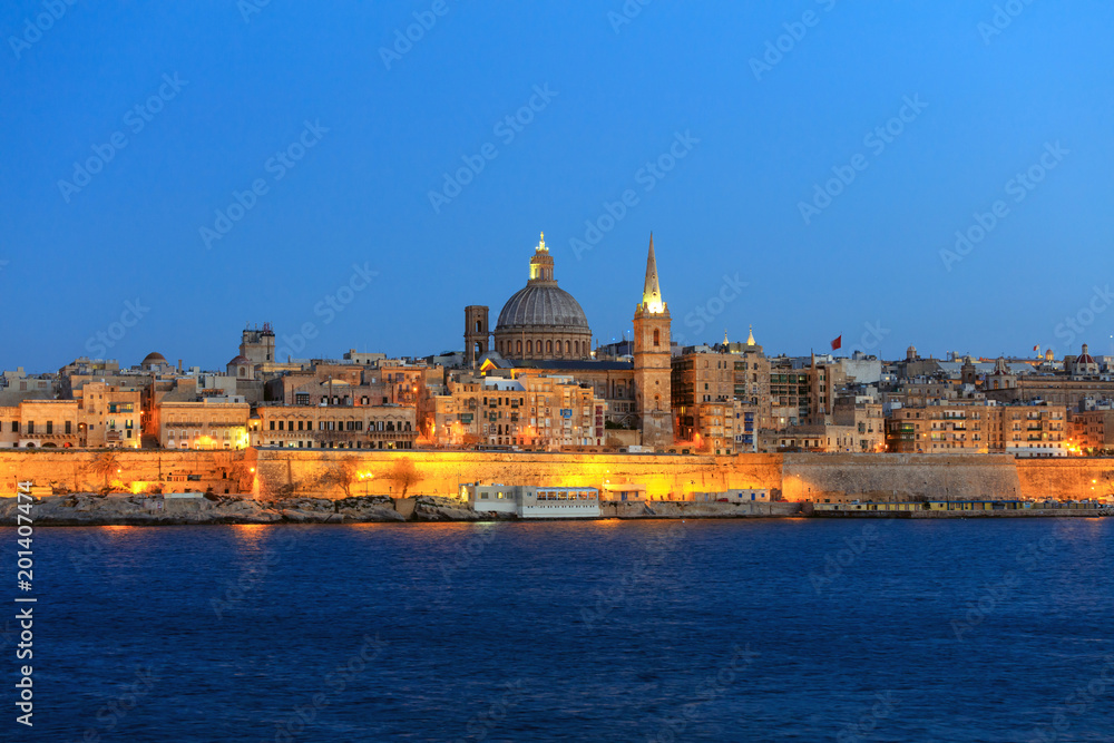 Valletta, Malta, Skyline in the evening with the dome of the Carmelite Church and the tower of St Paul`s