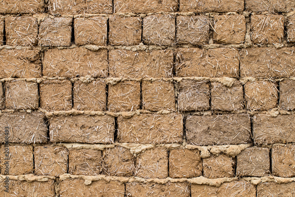 Fototapeta premium Weathered stained old brick wall background. close-up