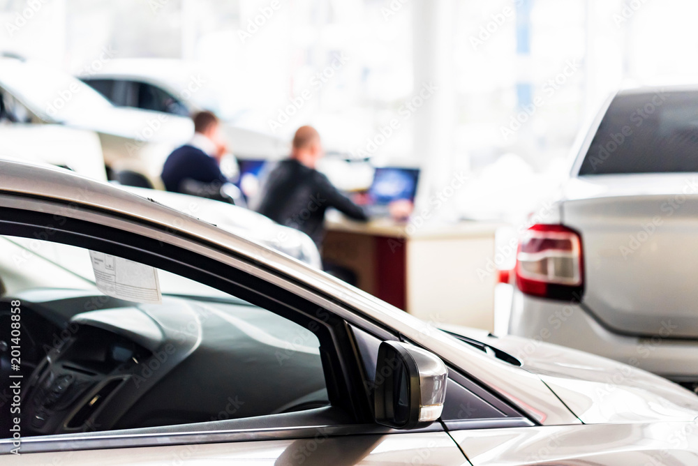 New cars at dealer showroom blurred background New cars at dealer showroom blurred background