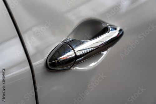 Modern grey car door handle close