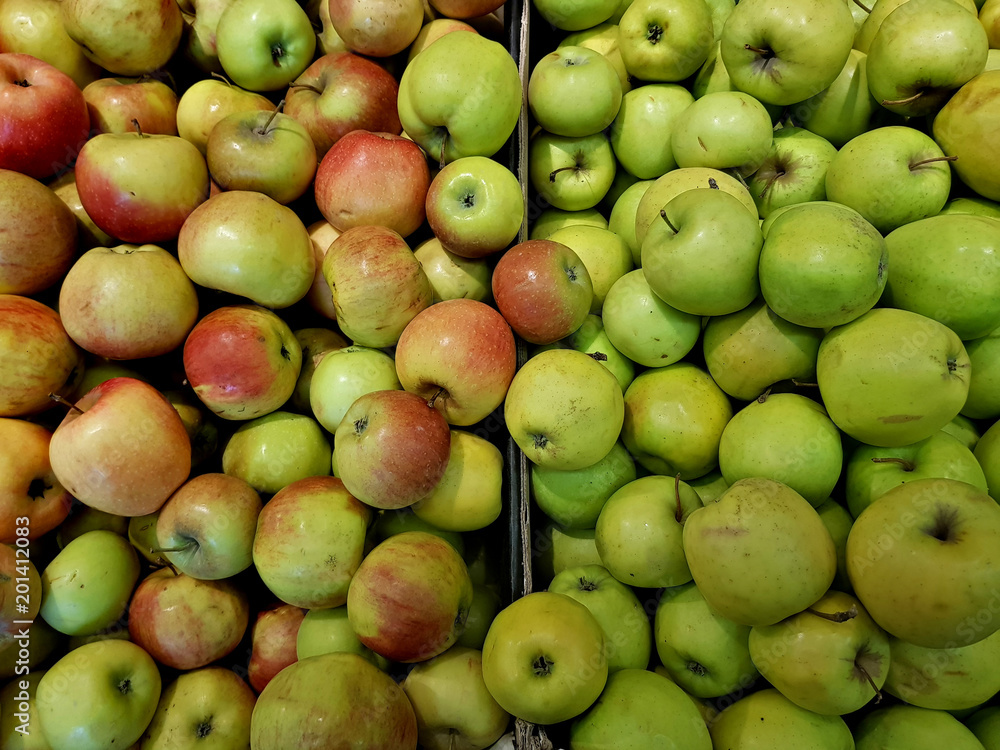 Fresh green apples lie in the shop window
Fresh green apples lie in the shop window