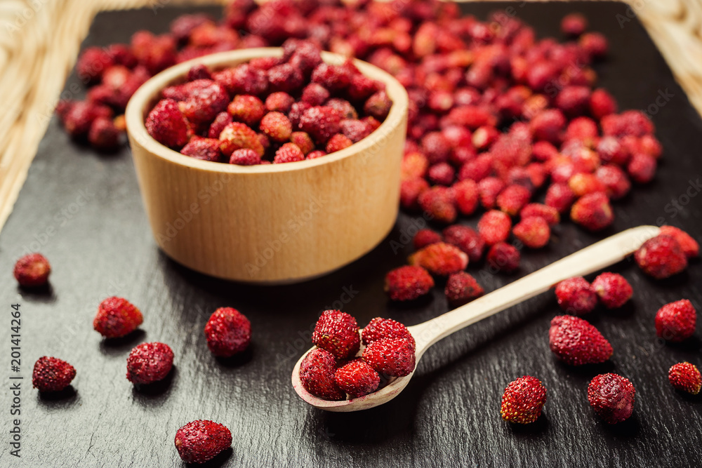 red strawberries in bowl on a wooden background red strawberries in bowl on a wooden background
