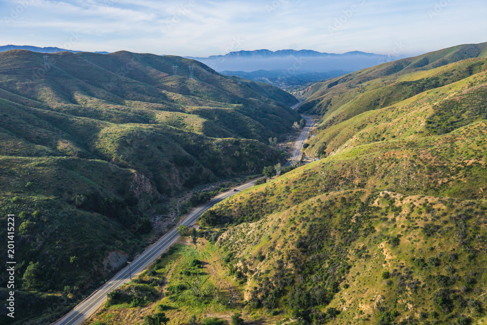 Obraz premium Narrow road leads through the canyon country of southern California.