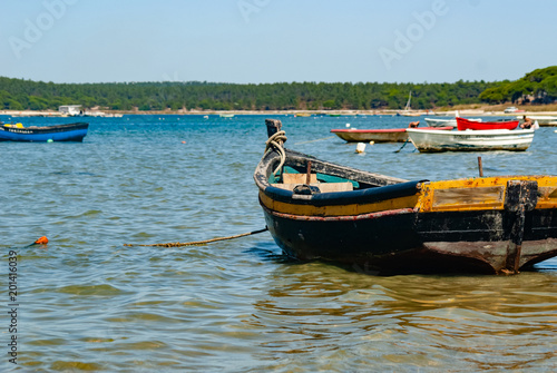 Coastal landscape with old fishing boat.