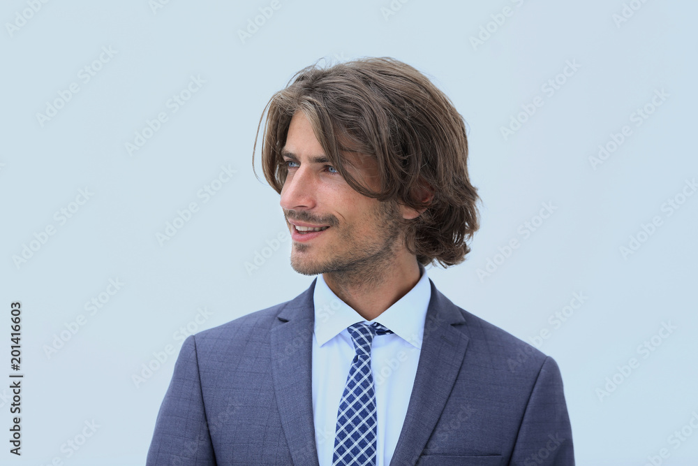 Handsome man in stylish clothes is looking away and smiling Handsome man in stylish clothes is looking away and smiling