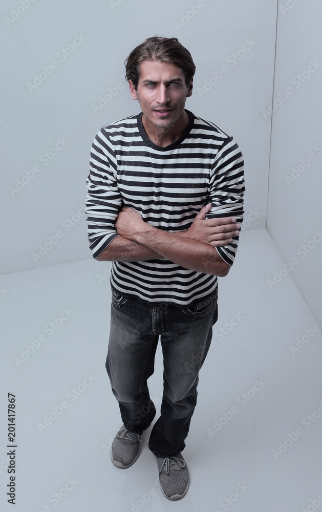 modern man standing in the corner of the white room . modern man standing in the corner of the white room .