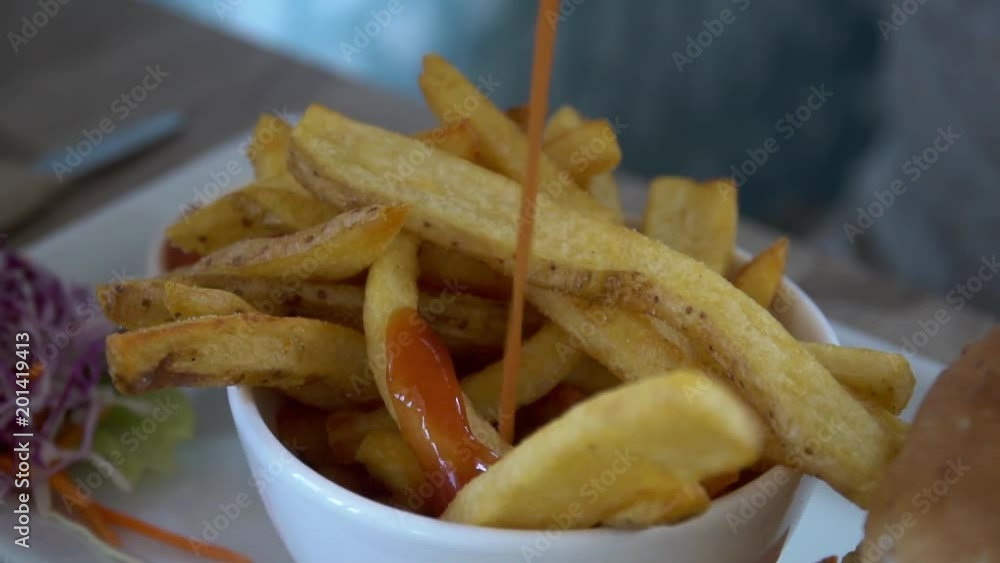 Dressing French Fries with Ketchup Dressing French Fries with Ketchup