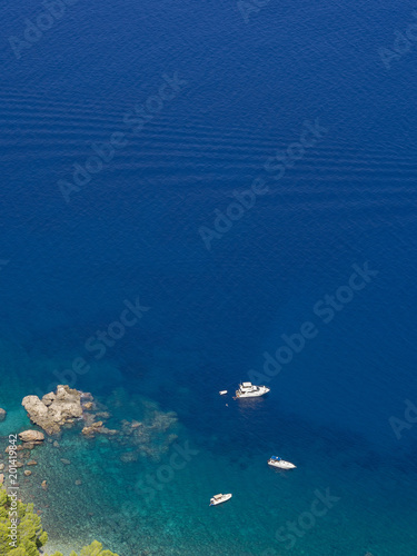 boats and blue water vertical background