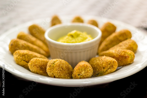 Chickpea croquettes with avocado mayonnaise on a white plate