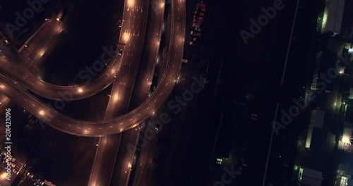 Aerial night illuminated view of city blocks and road systems in a developing city, Moscow, Russia. Development, illumination, lifestyle concept. photo