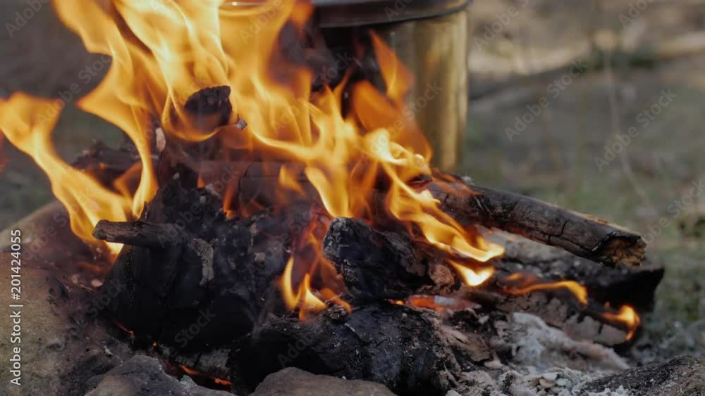 Close up of campfire, tourists cooking on fire Close up of campfire, tourists cooking on fire