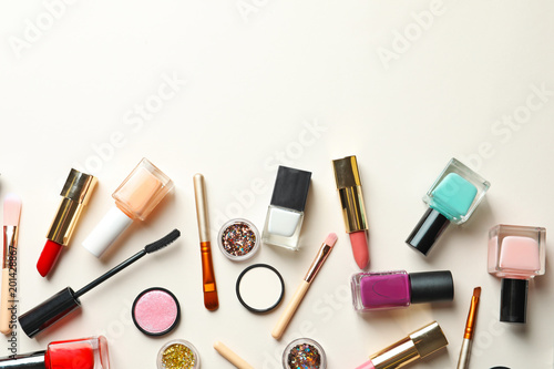 Flat lay composition with decorative cosmetics on color background