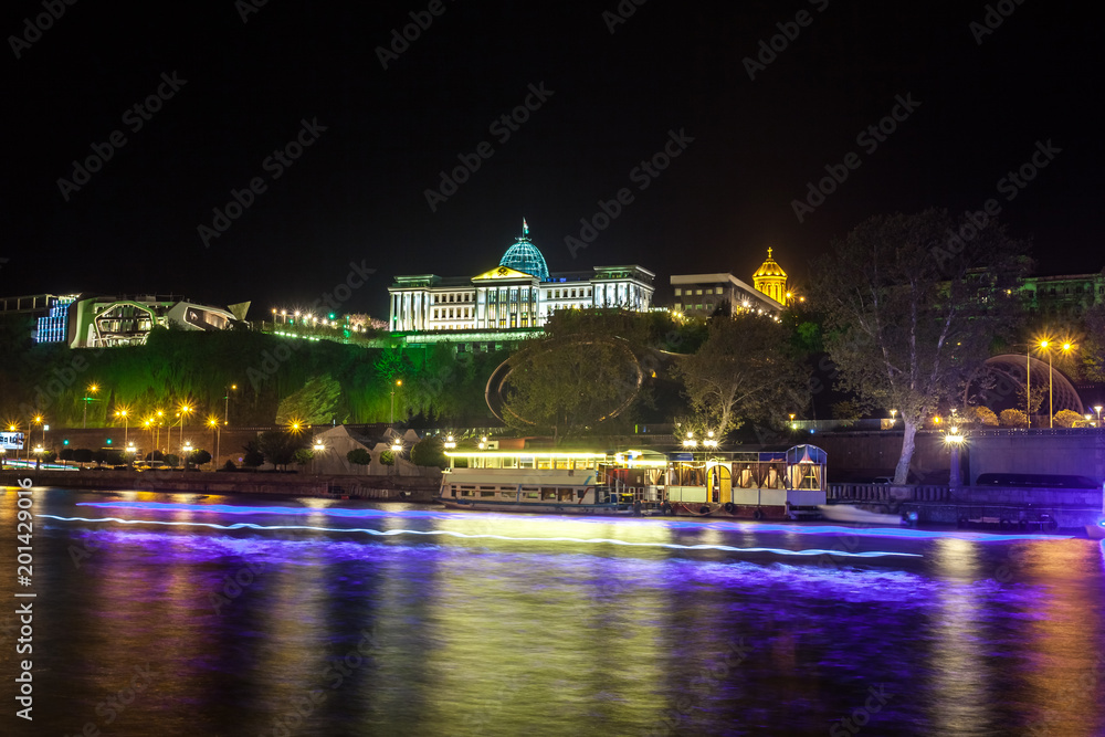Fototapeta premium Georgia, Tbilisi night . View from the right bank of the Kura River to the Presidential Palace