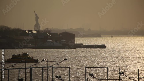 Ferry Sailing At Sunset With Statue Of Liberty NYC