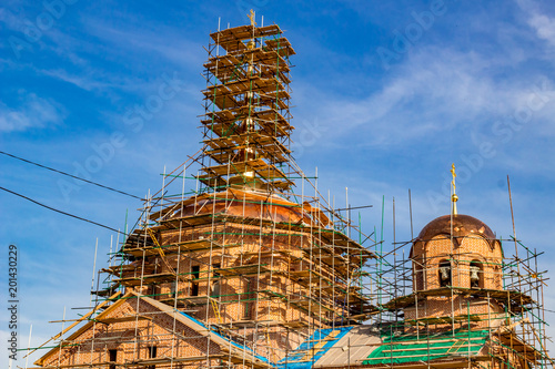 KOMLEVO, RUSSIA - JULY 2017: Construction of the Church of the Nativity of John the Baptist (Rozhdestva Ioanna Predtechi) in the village of Komlevo photo