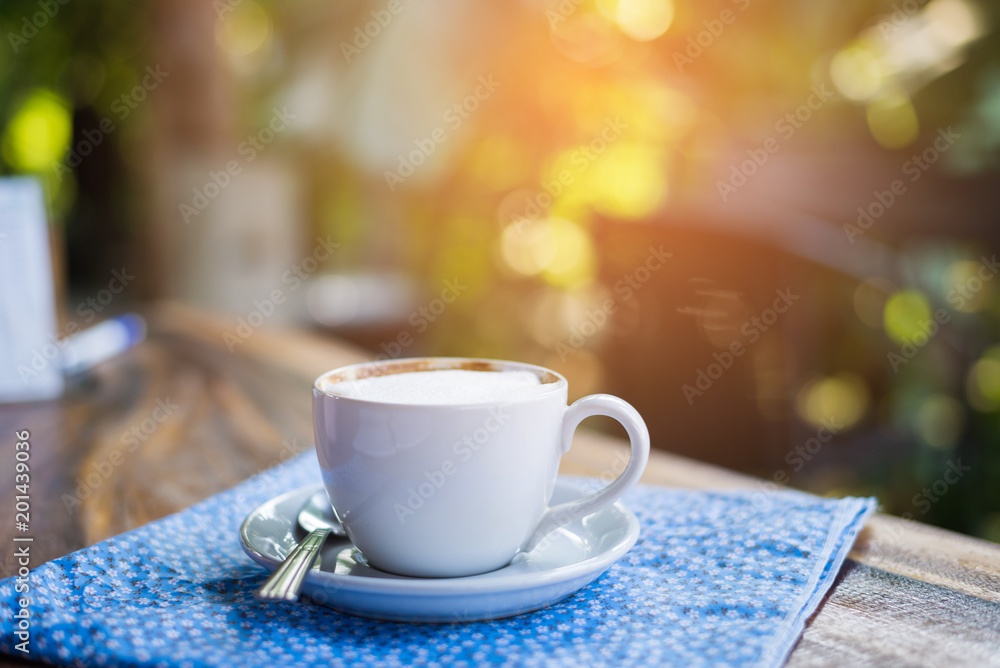 Coffee espresso on wood table nature background in garden,warm tone Coffee espresso on wood table nature background in garden,warm tone