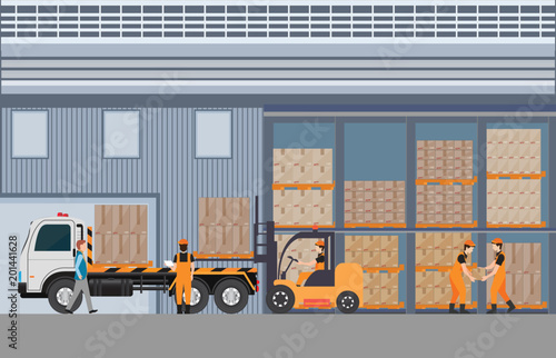 Workers man loading the truck with pallets of goods at the industrial warehouse .