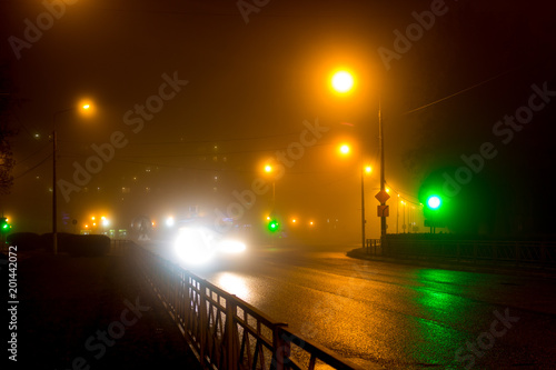 City road in the evening during a thick fog  