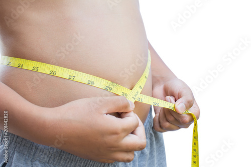 Close up hands boy measuring tape on abdominal surface , Fat and health care concept.