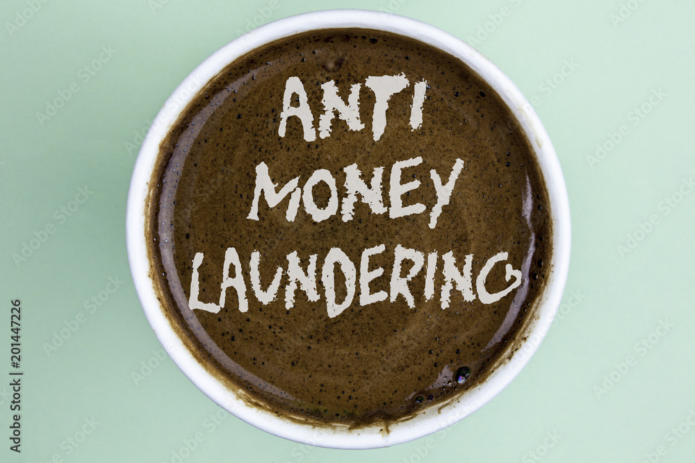 Writing note showing Anti Monay Laundring. Business photo showcasing entering projects to get away dirty money and clean it written on Coffee in a Cup on the plain background. Writing note showing Anti Monay Laundring. Business photo showcasing entering projects to get away dirty money and clean it written on Coffee in a Cup on the plain background.