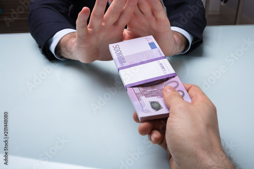 Quadro su tela Close-up Of A Businessman's Hand Refusing Bribe