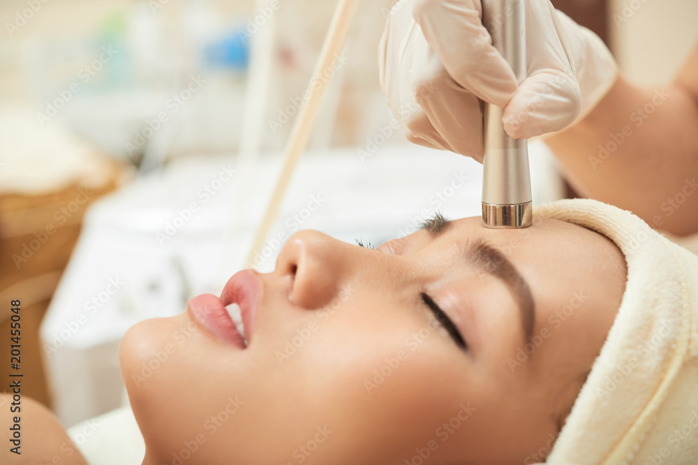 Naklejka premium Enjoying Facial Massage