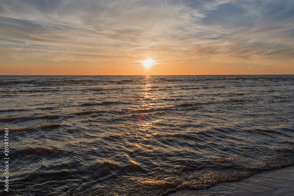 Naklejka premium Sunset in Baltic sea at Latvia coast.