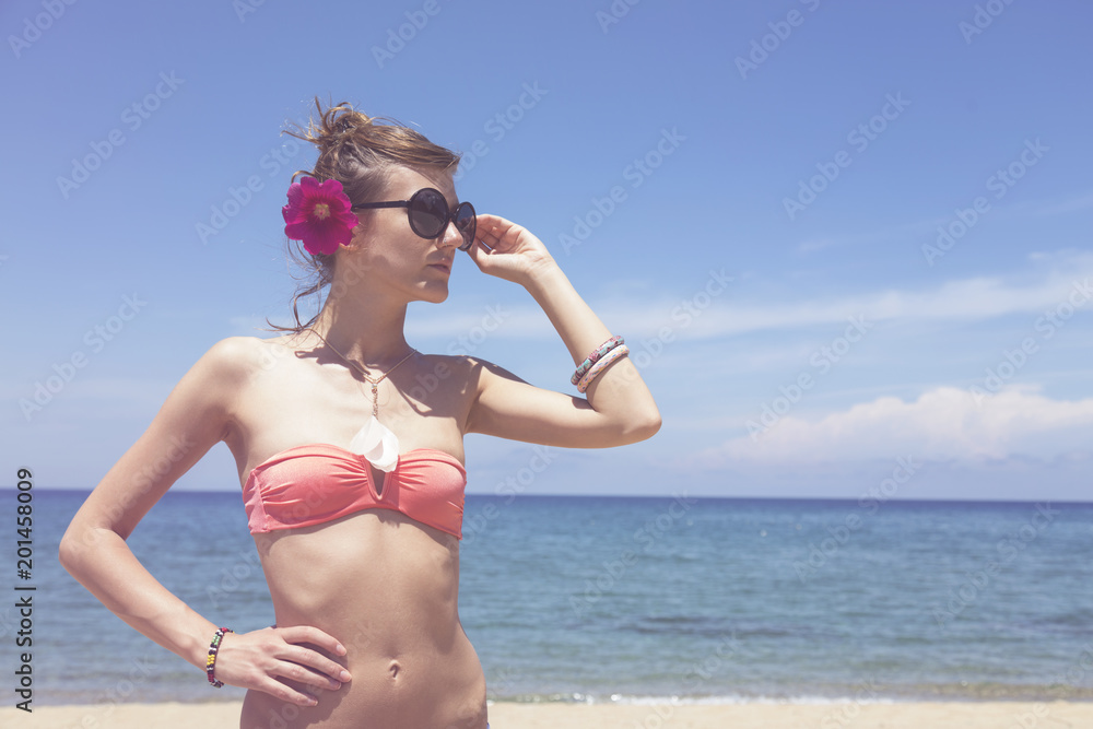 Beautiful smiling woman enjoying life on the tropical beach. Summer concept. Beautiful smiling woman enjoying life on the tropical beach. Summer concept.