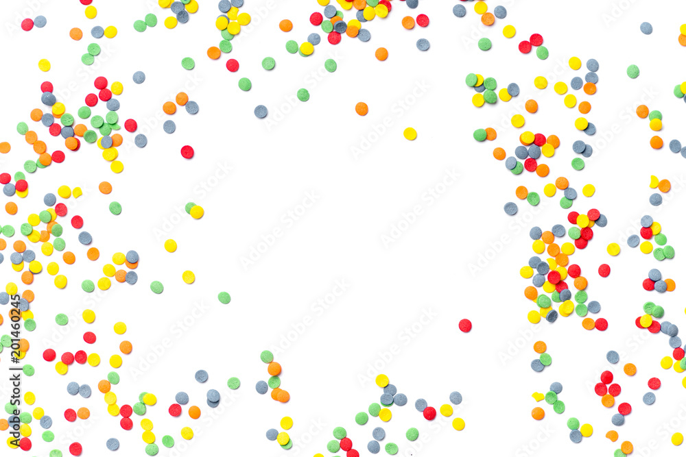 Colorful sweet confetti topping on white background with copy space at the center Colorful sweet confetti topping on white background with copy space at the center